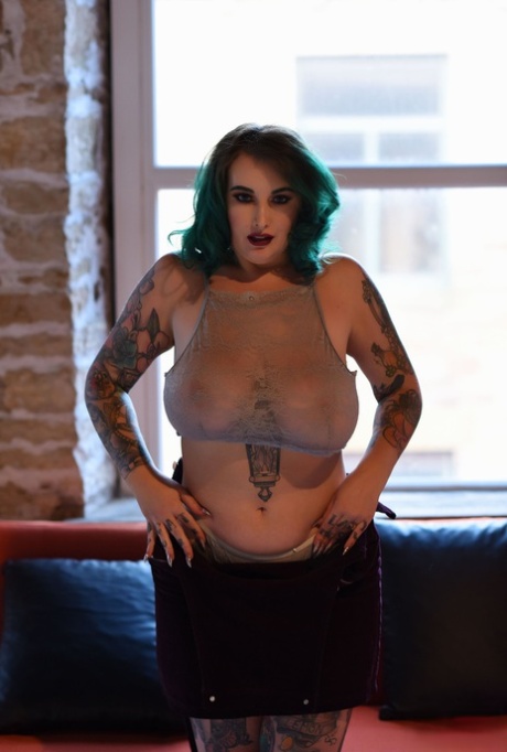 In this photo of Galda Lou, the chubby but otherwise green-haired babe, we witness her massive breasts and curly asses.