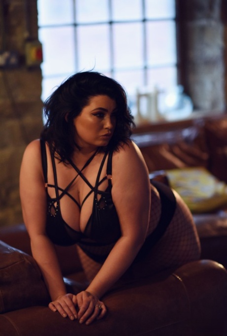 Stunning fat Kiki releases her juicy tits while engaging in playful play with her slutty nylons.