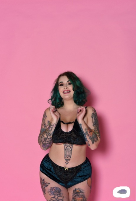 Model Galda Lou gets rid of her lingerie and exposes the inked curves.