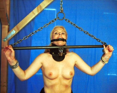 Paige, a submissive prostitute, is bound and humiliated during a bondage session.