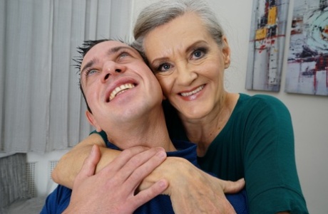 Horny granny Birgitta K receives a strong applause from her young neighbor.