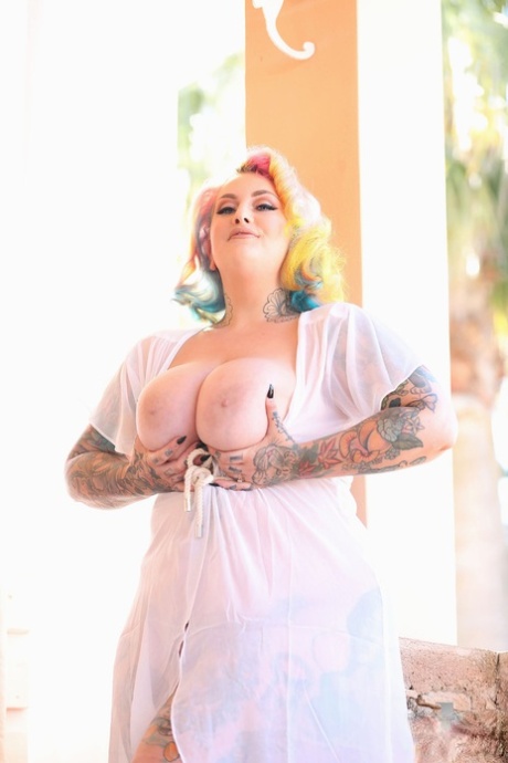 BBW Galda Lou, with her rainbow-haired face, exposes her giant tattoos and body parts.