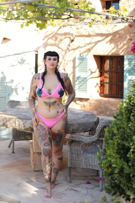 Tattoo model Refen poses in fully fashioned stockings and cotton underwear