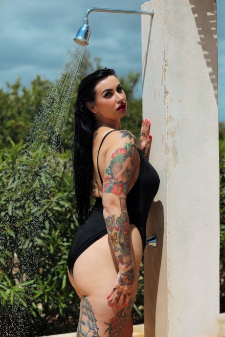 During the shower outside, Chubby's tattooed babe Cherrie Pie is seen in a swimsuit.