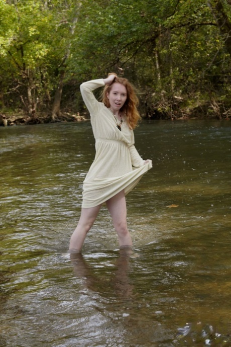 Redheaded American Pornstar Nicki Blue Reveals Her Cute Ass In The River