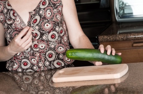 In her ejaculatory pussy, Ana Molly, the hot housewife, inserts a large cucumber inside her vagina.