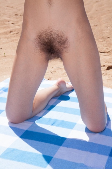 Beachbody: Cleo Dream, the hairy brunette with full-skinned lashes, undresses and masturbates while on the beach.