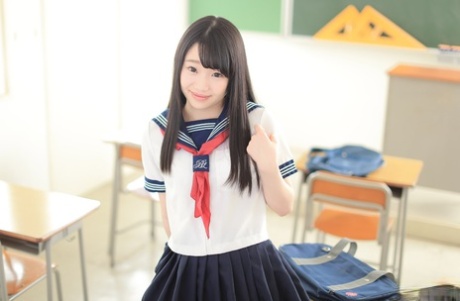 At school, Yuna Himekawa, a cute Asian student in high school, spreads her legs and takes a dick.