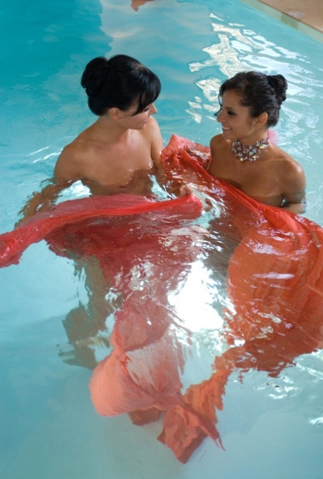 Extensive boning: Lucy Belle and Suzie Diamond pose poolside with their seductively skinny legs.