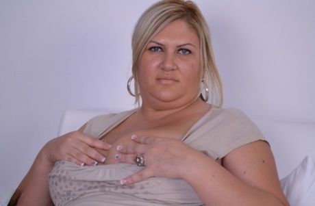 After losing her clothes, Chubby Caroline becomes a mature adult and masturbates at a slow pace.