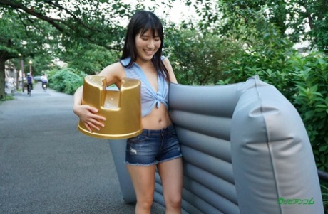 The muff is filled with a dong and Tomoka Nanako, an Asian brunette girl, strips for her reward.