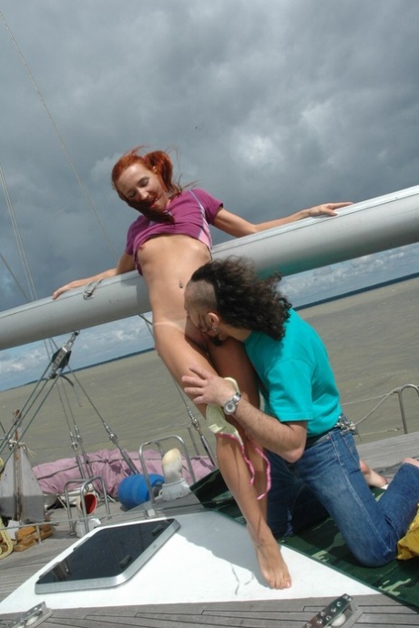Redheaded Teen Kimberly Rubs Her Nipples While Riding A Warm Knob On A Boat