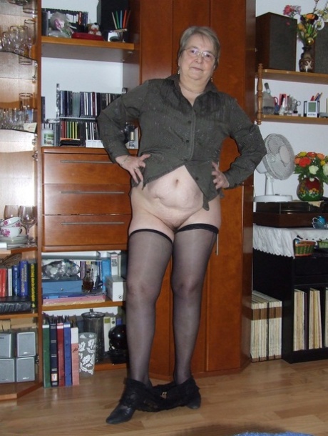 With her glasses on, Chubby Grandma Sybille was seen stripping and playing with her oversized pussy.