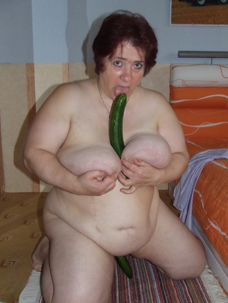 In order to achieve her sexual goals, Corinna, who is now 83 years old, applies a condom to a large cucumber and engages in self-pleasure.