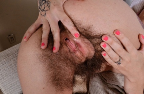 At close range, Pearl Sage, a small bobbing hippie, displays her hairy anal area and vagina.