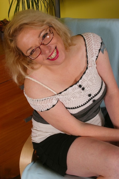 Stunning homemaker Jane M enjoys petting her plump and hairy pussy.