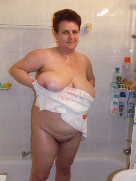 Ingeborg, a woman who is not very well-liked and spends her time in the bathroom, enjoys cuddling with her saggy breasts.