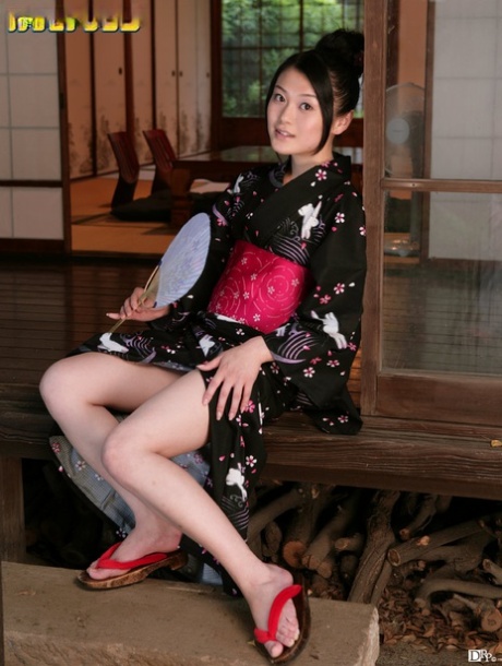The charming Japanese doll Kyoko Nakajima covertly exhibits her bushy twat and tiny tits.