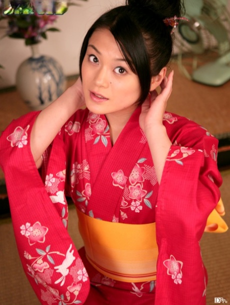 Kyoko Nakajima, sexy Japanese doll, covertly exhibits her bushy twat and tiny tits.