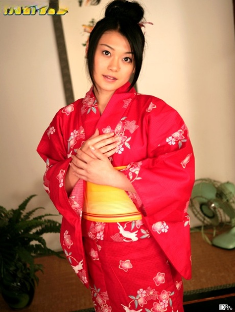 Kyoko Nakajima, a charming Japanese doll, covertly exhibits her bushy twat and tiny tits.