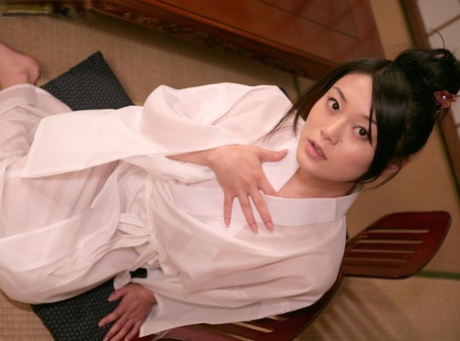 Japanese doll Kyoko Nakajima, who is charming and hides her bushy twat with her tiny tits in secret.