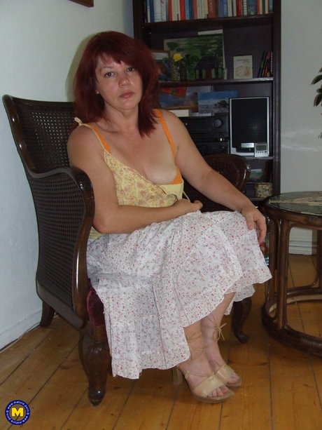 Mature Housewife Julia Undressing And Touching Herself In The Chair