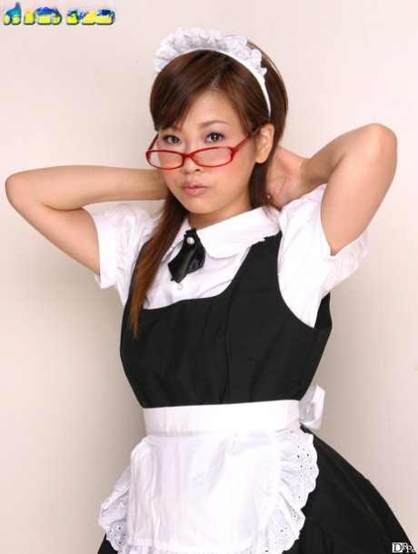 The attractive Asian maid Miku Hayama gets her hair slicked onto a couch.