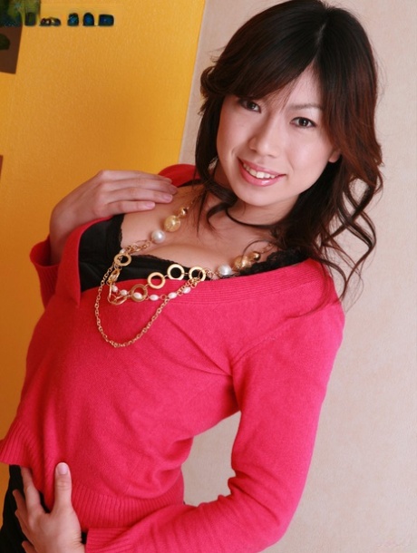 An Asian girl named Hina Kasuga, who has small tits, undresses and performs nude hot poses.