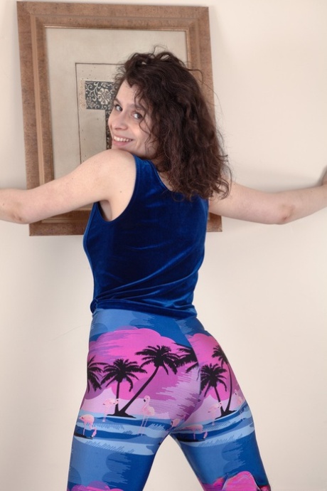 With her curly hair on display, Sabrina Eve flaunts her leggings and displays her hairy pussy.