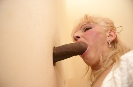 Blonde Granny MaireAnn Gets Blacked Through A Gloryhole And Enjoys A Facial