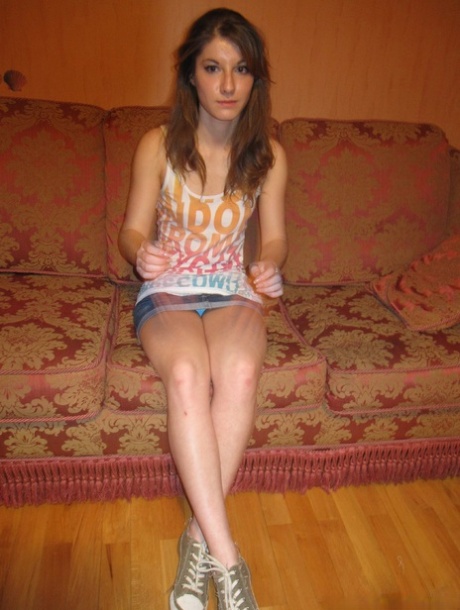 Slender amateur teen Julia posing topless in her lovely panties on the sofa #12