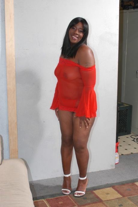 A curvaceous ebony with a sizable bony bum is displayed by Dimples, who then plays with it and performs a dick lick.