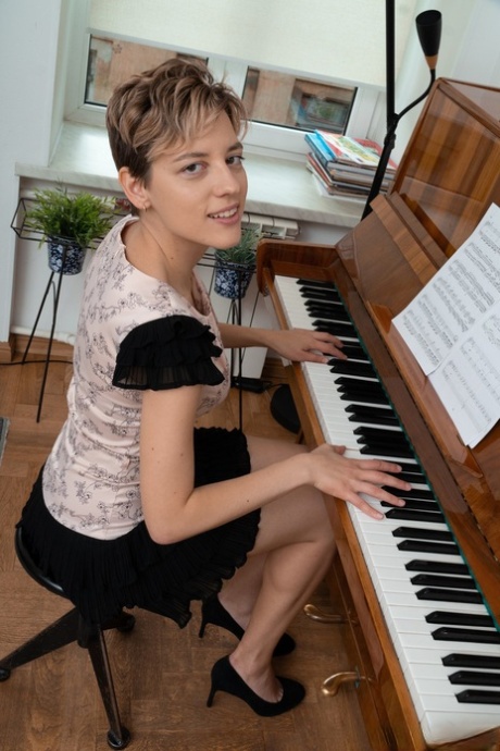Short-haired Doll Calina Strips & Shows Her Hairy Cunt While Playing Piano
