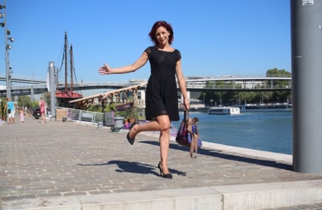 In public, Morgane Dell, a French redhead attractive and mature, displays her cunty with flair.