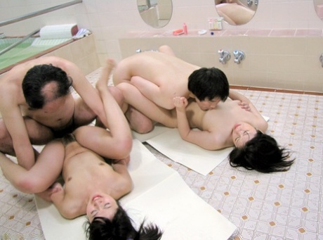 A large number of Japanese nymphos with small tits are forced onto the toilet floor.