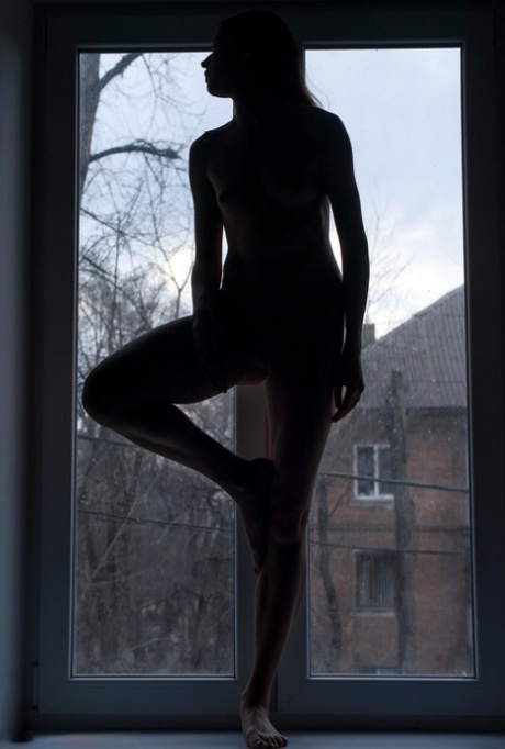 Gorgeous Skinny Teen Maat Showing Off Her Flexible Body At The Window