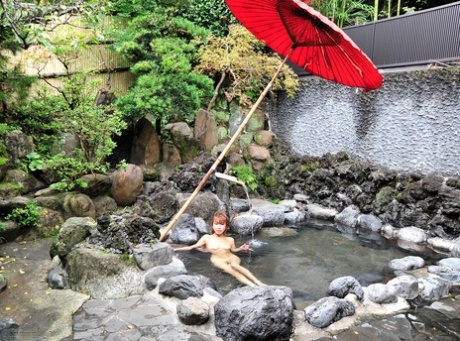 Jun Kusanagi, a cute young woman from Japan who is dressed in her favorite hot clothes and nude, poses alone in her solo act.