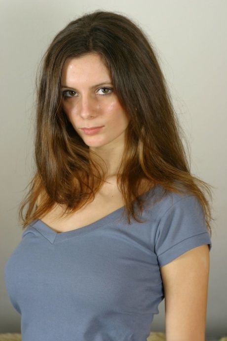 Uncommonly, the adorable Martina ties her pants in place with ribbons and presents herself as a satin-covered buttocks.