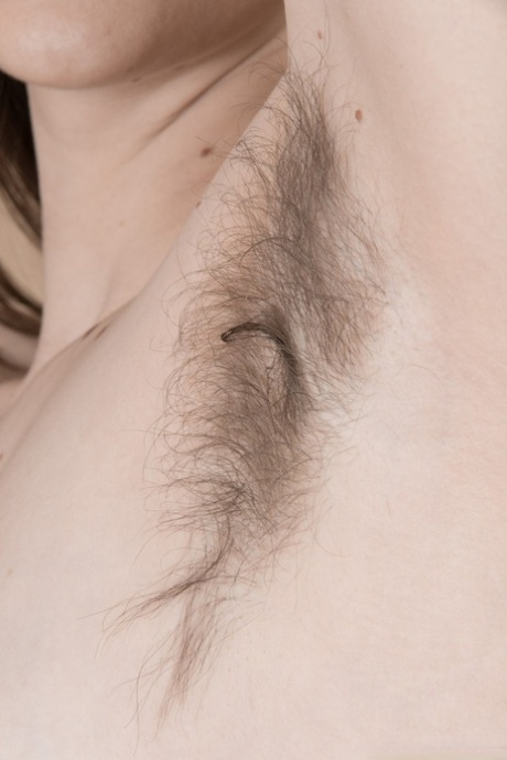 In a photo Donatella shows her brunette with hairy armpits flashing their "hair" and "hairy assholes."