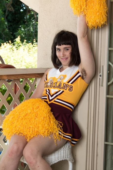 Attractive Cheerleader Barb Reveals Her Hairy Armpits And Pussy