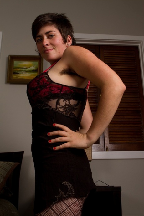 Louise, who is a housewife, removes her lace lingerie and displays it with her hairy beaver.