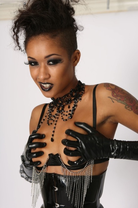 Slender Ebony Doll Skin Diamond Poses In Stocking And Leather Outfit Solo