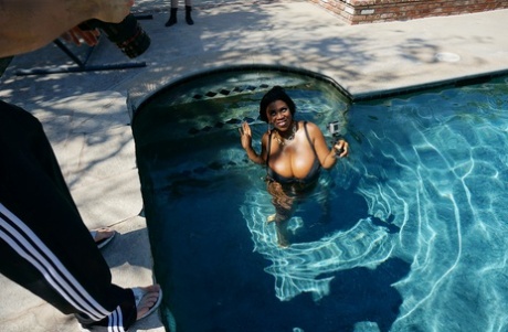 She is in the pool with a large and heavily endowed Maserati XXX that has huge tits floating around her.