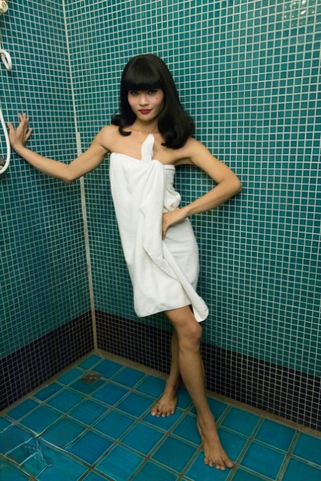 Her big penis in the shower stall is playedfully handled by Ning, who is an Asian shemale.