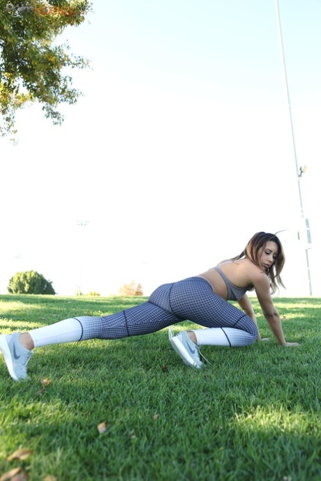 During her workout, Demi Lopez takes a break to masturbate while wearing a bathing suit on the lawn.