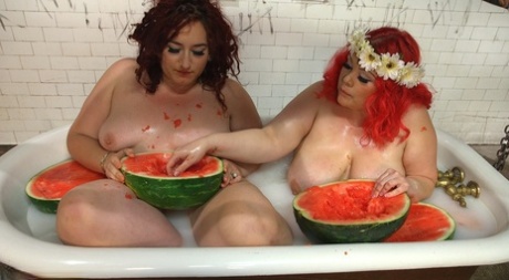 Before their male subseat eats their twats, Obese females consume melons in a tub.