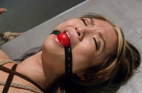 During painful sexual encounters, Mia Rider is both restricted and ball gagged.