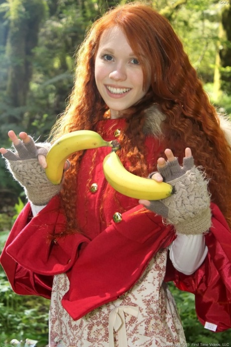 Tiny Redhead Teen Dolly Enjoys Solo Masturbation With Bananas In The Forest