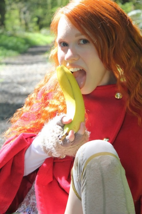 Tiny Redhead Teen Dolly Enjoys Solo Masturbation With Bananas In The Forest