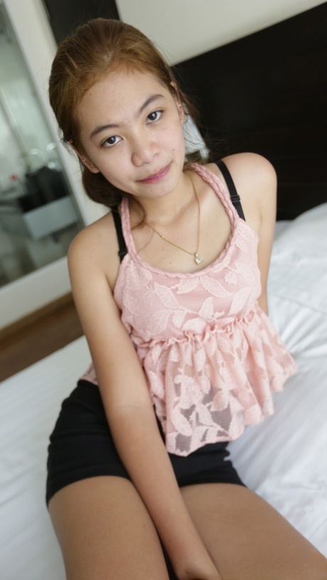 Mint is depicted as a petite Thai girl who removes her clothes and displays her hairy pussy on her face.